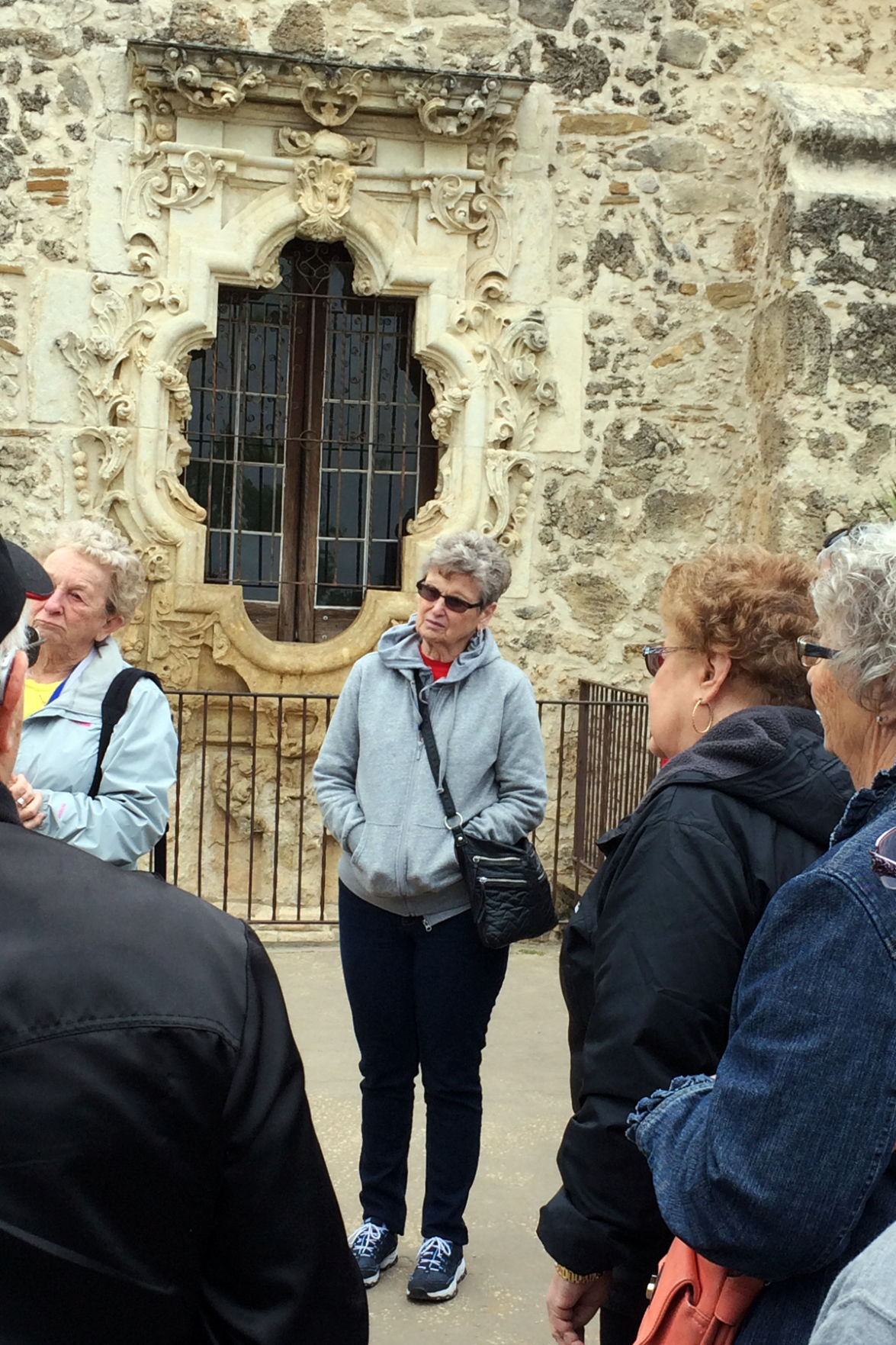 108 Nancy Sewardi in front of the Rose Window at the San Jose mission.JPG